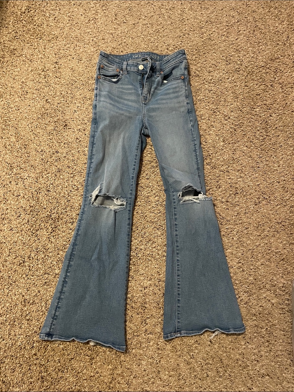 American Eagle Outfitters Light Blue Flare Jeans with Knee Rips